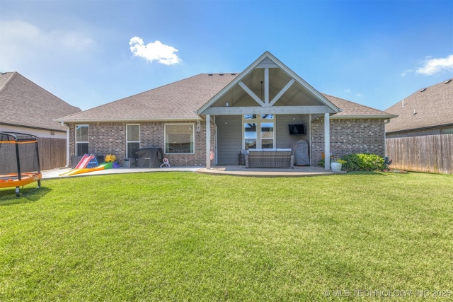 23107 E 104th Pl S, Broken Arrow, OK 74014 - back of property featuring a patio area, brick siding, and roof with shingles