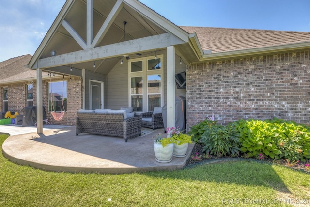 23107 E 104th Pl S, Broken Arrow, OK 74014 - rear view of property featuring brick siding, a patio, and a shingled roof
