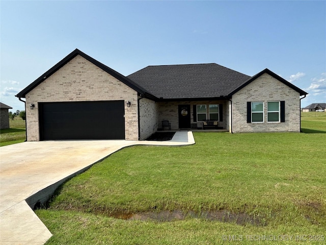 128 Crimson Ln, Calera, OK 74730 - view of front facade featuring an attached garage, driveway, a front yard, and brick siding