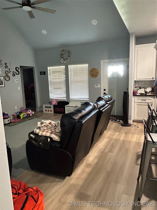 128 Crimson Ln, Calera, OK 74730 - living area with a ceiling fan, light wood-style floors, and vaulted ceiling
