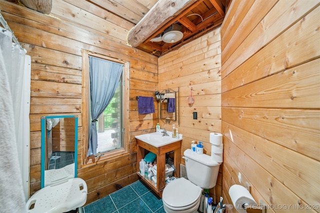 21745 E 660th Rd, Tahlequah, OK 74464 - bathroom featuring wood walls, toilet, and tile patterned floors