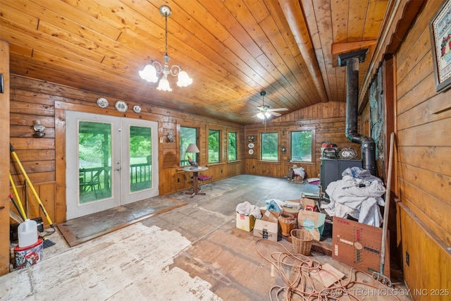 21745 E 660th Rd, Tahlequah, OK 74464 - interior space featuring french doors, a wood stove, lofted ceiling, wooden ceiling, and a chandelier