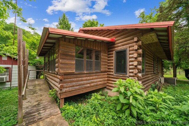 21745 E 660th Rd, Tahlequah, OK 74464 - view of property exterior featuring log siding