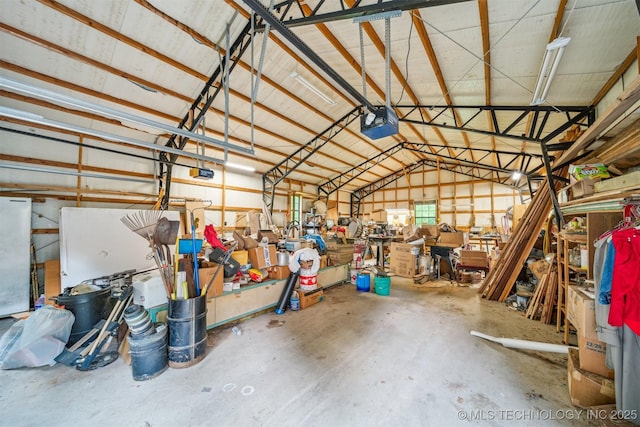 21745 E 660th Rd, Tahlequah, OK 74464 - garage with a garage door opener and a workshop area