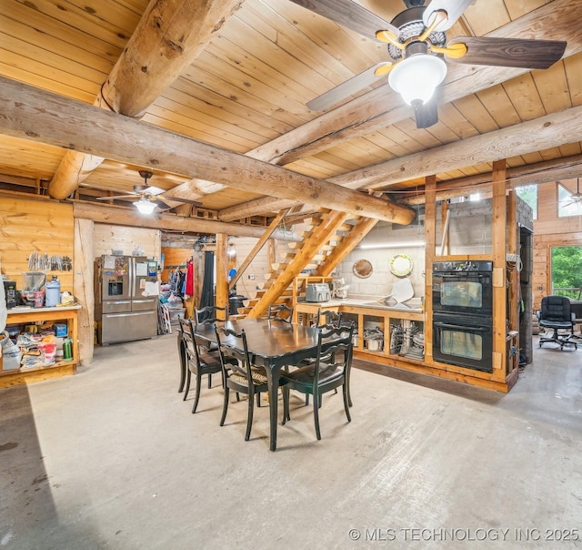21745 E 660th Rd, Tahlequah, OK 74464 - dining area with a ceiling fan, concrete flooring, wood ceiling with exposed beams, and stairs