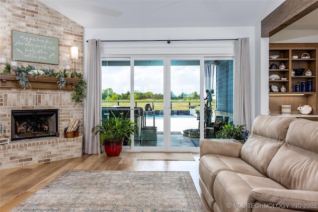46 Red Cedar Cir, Durant, OK 74701 - living area with wood finished floors and a fireplace