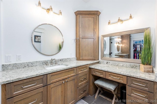 46 Red Cedar Cir, Durant, OK 74701 - bathroom featuring vanity, a spacious closet, and tile patterned flooring