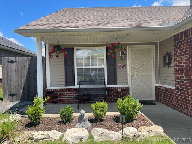 141 W Fairlane Pl, Sapulpa, OK 74066 - property entrance with brick siding, roof with shingles, and a porch