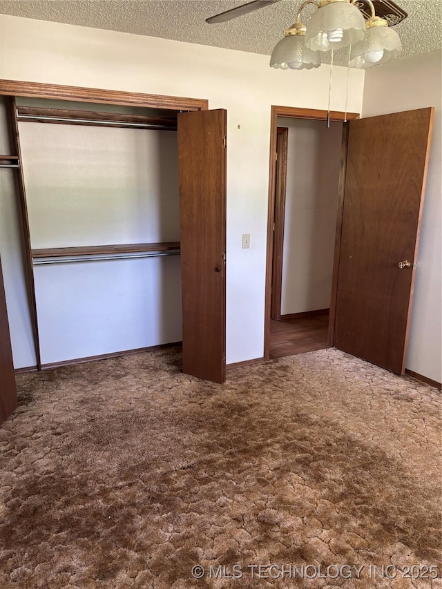 1339 E 9th St, Cushing, OK 74023 - unfurnished bedroom with a closet, carpet, a textured ceiling, and ceiling fan