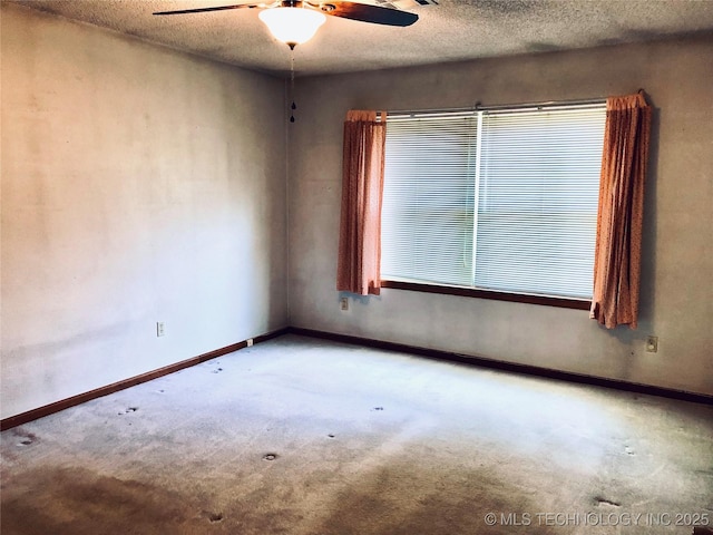 3814 E Dripping Springs Rd, Cushing, OK 74023 - carpeted empty room featuring a ceiling fan, healthy amount of natural light, baseboards, and a textured ceiling