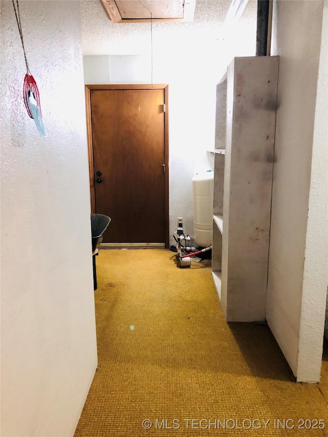 3814 E Dripping Springs Rd, Cushing, OK 74023 - hall with carpet flooring and attic access