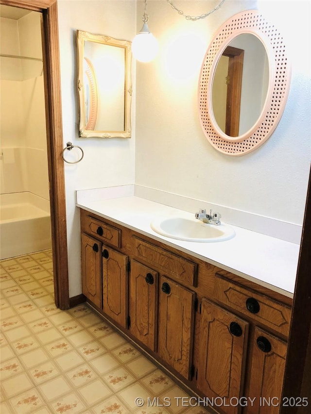 3814 E Dripping Springs Rd, Cushing, OK 74023 - full bath with tile patterned floors, vanity, and washtub / shower combination