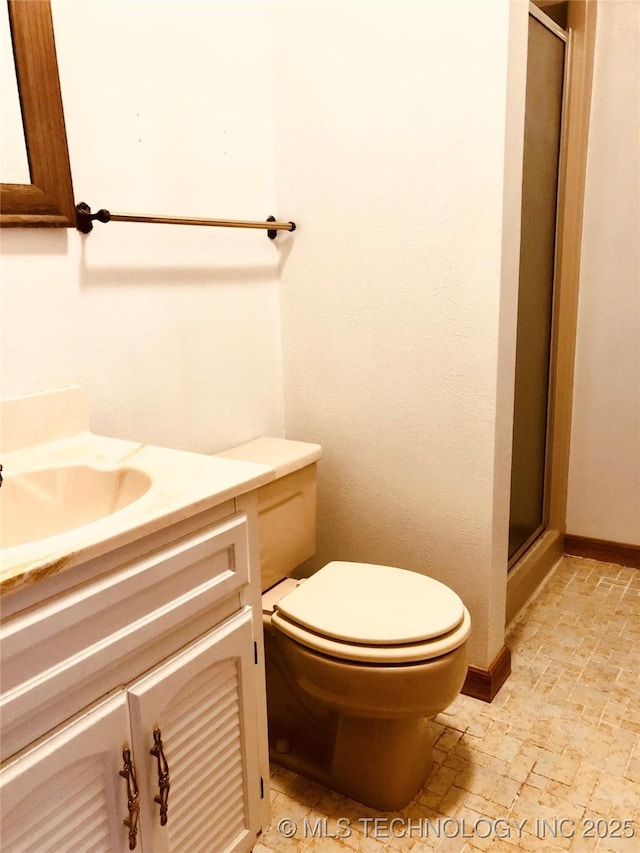 3814 E Dripping Springs Rd, Cushing, OK 74023 - full bath with a shower stall, toilet, vanity, and stone tile floors