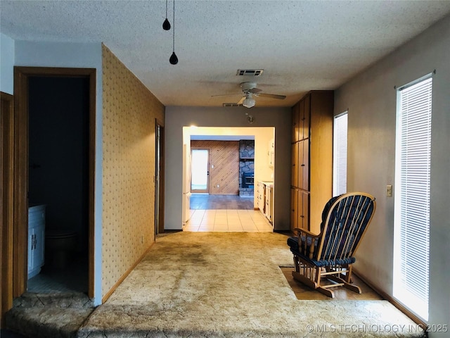 3814 E Dripping Springs Rd, Cushing, OK 74023 - corridor with a textured ceiling, light colored carpet, and wallpapered walls