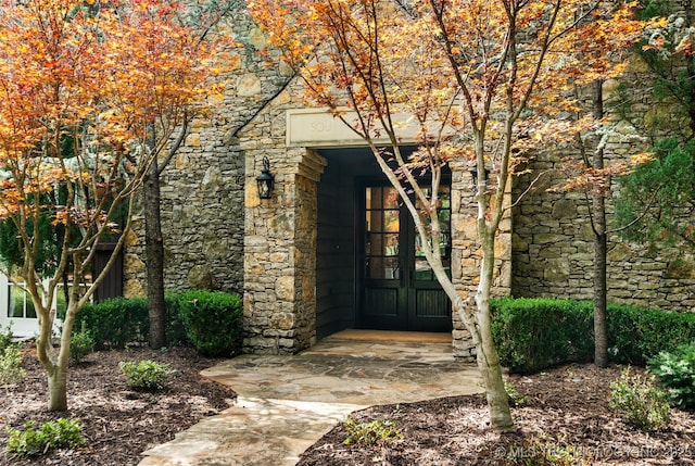 10144 N Dover Pl, Owasso, OK 74055 - property entrance with stone siding and french doors
