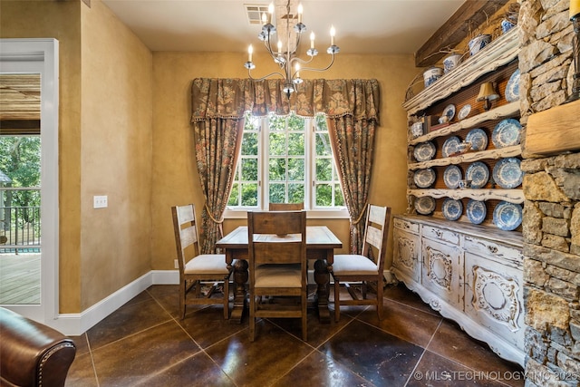 10144 N Dover Pl, Owasso, OK 74055 - dining room with dark tile patterned floors and a chandelier