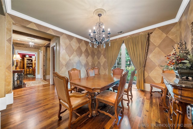 10144 N Dover Pl, Owasso, OK 74055 - dining room with crown molding, wood-type flooring, a chandelier, and wallpapered walls