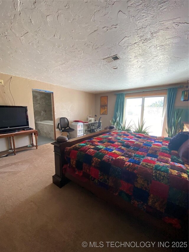 11477 State Highway 70, Madill, OK 73446 - carpeted bedroom featuring a textured ceiling