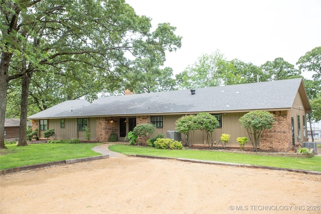 802 W Sand Pt, Mead, OK 73449 - single story home with a shingled roof, a front lawn, central AC, and brick siding