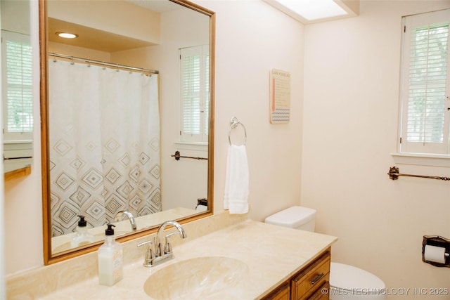 802 W Sand Pt, Mead, OK 73449 - full bathroom with toilet, vanity, and plenty of natural light