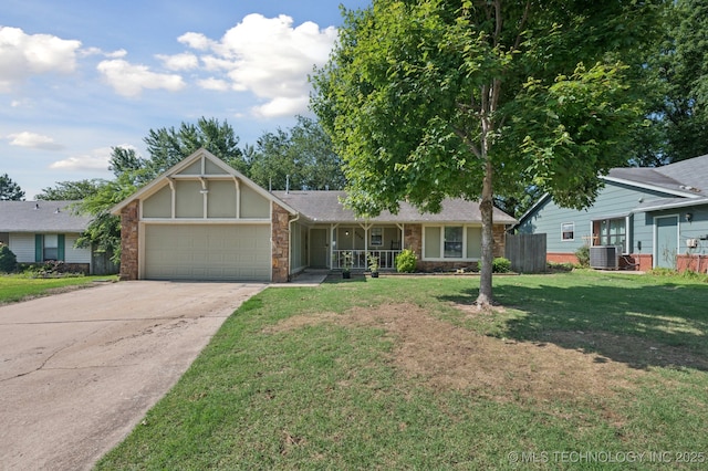 4509 W Toledo St, Broken Arrow, OK 74012 - view of front facade featuring a garage, stone siding, driveway, a front lawn, and covered porch