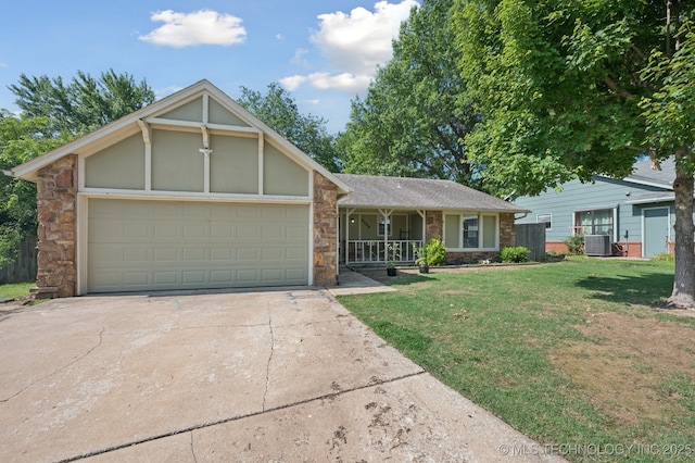4509 W Toledo St, Broken Arrow, OK 74012 - view of front facade with stone siding, concrete driveway, a front lawn, an attached garage, and covered porch