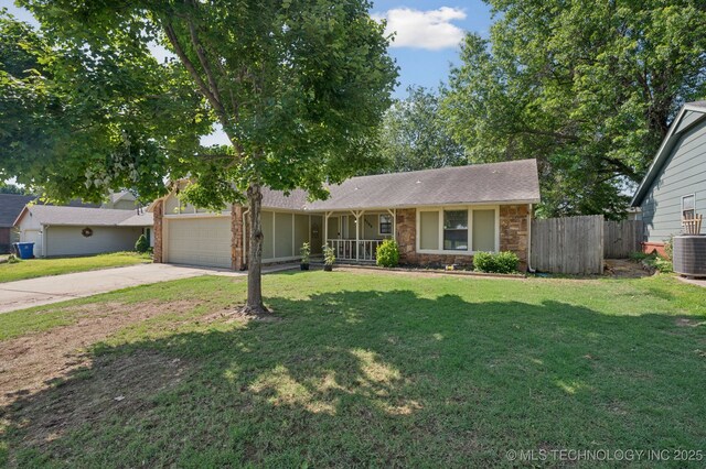 4509 W Toledo St, Broken Arrow, OK 74012 - single story home with driveway, a garage, stone siding, and a porch