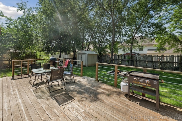 4509 W Toledo St, Broken Arrow, OK 74012 - wooden deck featuring a storage shed, outdoor dining space, and a fenced backyard
