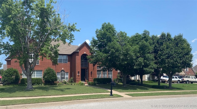 1816 W Sandusky St, Broken Arrow, OK 74012 - view of front facade with brick siding and a front lawn