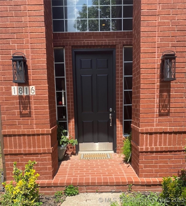 1816 W Sandusky St, Broken Arrow, OK 74012 - doorway to property featuring brick siding
