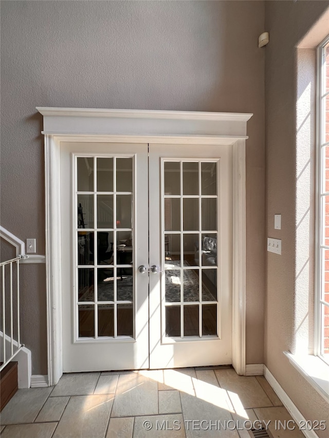 1816 W Sandusky St, Broken Arrow, OK 74012 - entryway with baseboards, stairway, tile patterned flooring, and french doors