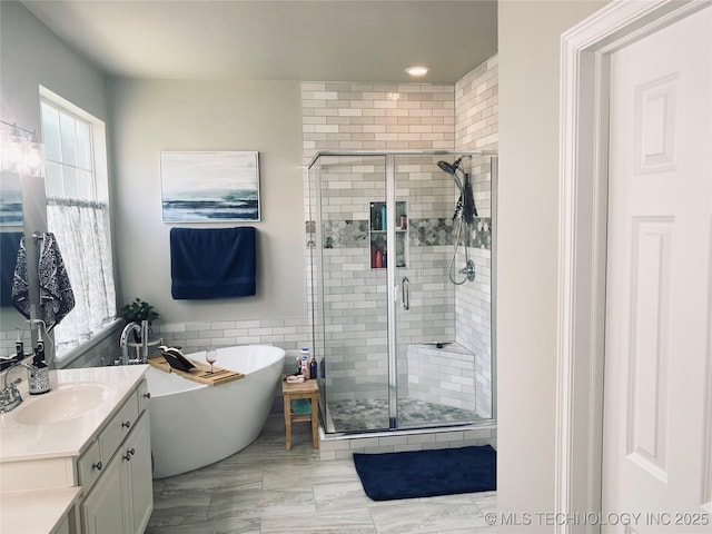 1816 W Sandusky St, Broken Arrow, OK 74012 - bathroom with vanity, a freestanding bath, and a stall shower