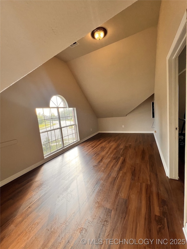1816 W Sandusky St, Broken Arrow, OK 74012 - additional living space featuring vaulted ceiling, wood finished floors, and baseboards