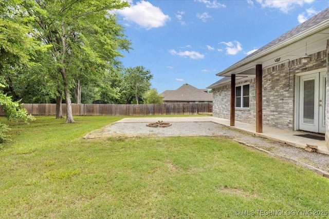 153 Founders Ln, Durant, OK 74701 - view of yard with a fire pit, french doors, and a patio