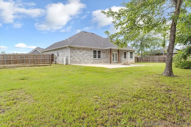 153 Founders Ln, Durant, OK 74701 - rear view of house featuring a patio, brick siding, and a shingled roof