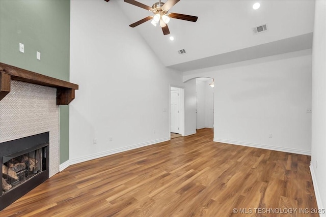 153 Founders Ln, Durant, OK 74701 - unfurnished living room with high vaulted ceiling, a ceiling fan, arched walkways, a fireplace, and recessed lighting