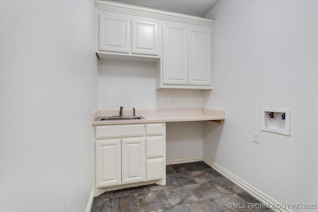 153 Founders Ln, Durant, OK 74701 - laundry area featuring washer hookup, cabinet space, and baseboards