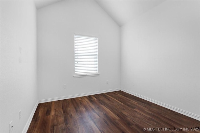 153 Founders Ln, Durant, OK 74701 - spare room featuring dark wood-type flooring, baseboards, and lofted ceiling