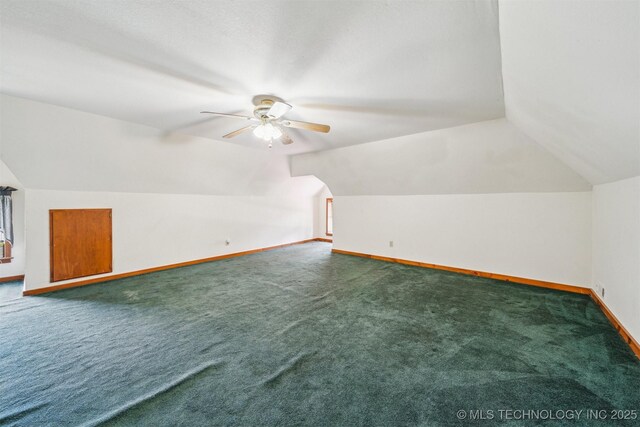 11029 N 3670th Rd, Okemah, OK 74884 - bonus room featuring baseboards, carpet flooring, a ceiling fan, and vaulted ceiling