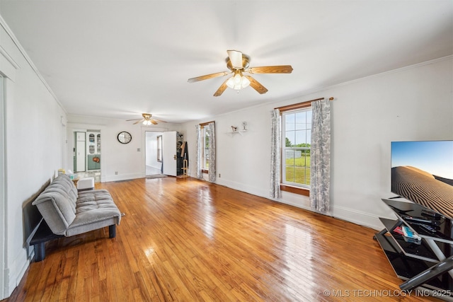 11029 N 3670th Rd, Okemah, OK 74884 - living area featuring ceiling fan, light wood-style flooring, baseboards, and ornamental molding
