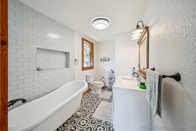 11029 N 3670th Rd, Okemah, OK 74884 - full bathroom featuring a soaking tub, vanity, tile patterned floors, and toilet