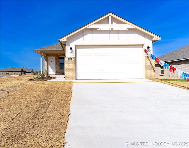 304 S 25th St, Collinsville, OK 74021 - ranch-style home with brick siding, concrete driveway, a garage, and board and batten siding