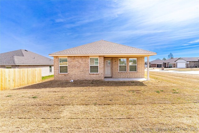 304 S 25th St, Collinsville, OK 74021 - view of front of house with brick siding, a patio, and a shingled roof
