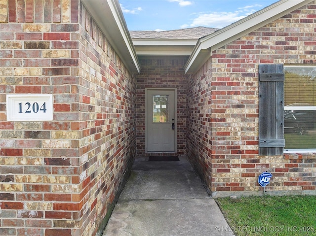 1204 Gantt, Marietta, OK 73448 - view of exterior entry with brick siding and roof with shingles