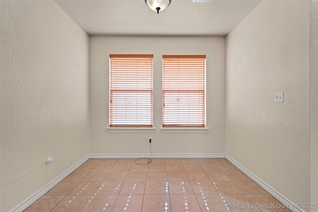 1204 Gantt, Marietta, OK 73448 - spare room with light tile patterned flooring and baseboards