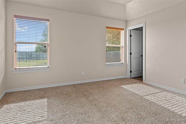 1204 Gantt, Marietta, OK 73448 - carpeted empty room with plenty of natural light and baseboards