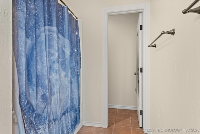 1204 Gantt, Marietta, OK 73448 - full bath with tile patterned flooring, baseboards, and a shower with shower curtain
