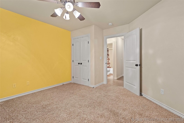 1204 Gantt, Marietta, OK 73448 - unfurnished bedroom featuring light carpet, baseboards, a ceiling fan, and a closet
