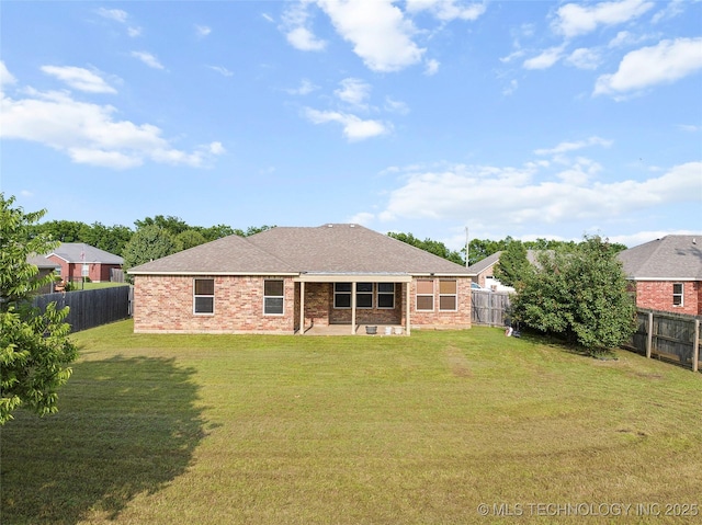 1204 Gantt, Marietta, OK 73448 - back of property featuring a patio, brick siding, and roof with shingles