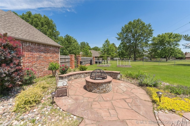21542 E 103rd St S, Broken Arrow, OK 74014 - view of patio / terrace with an outdoor fire pit